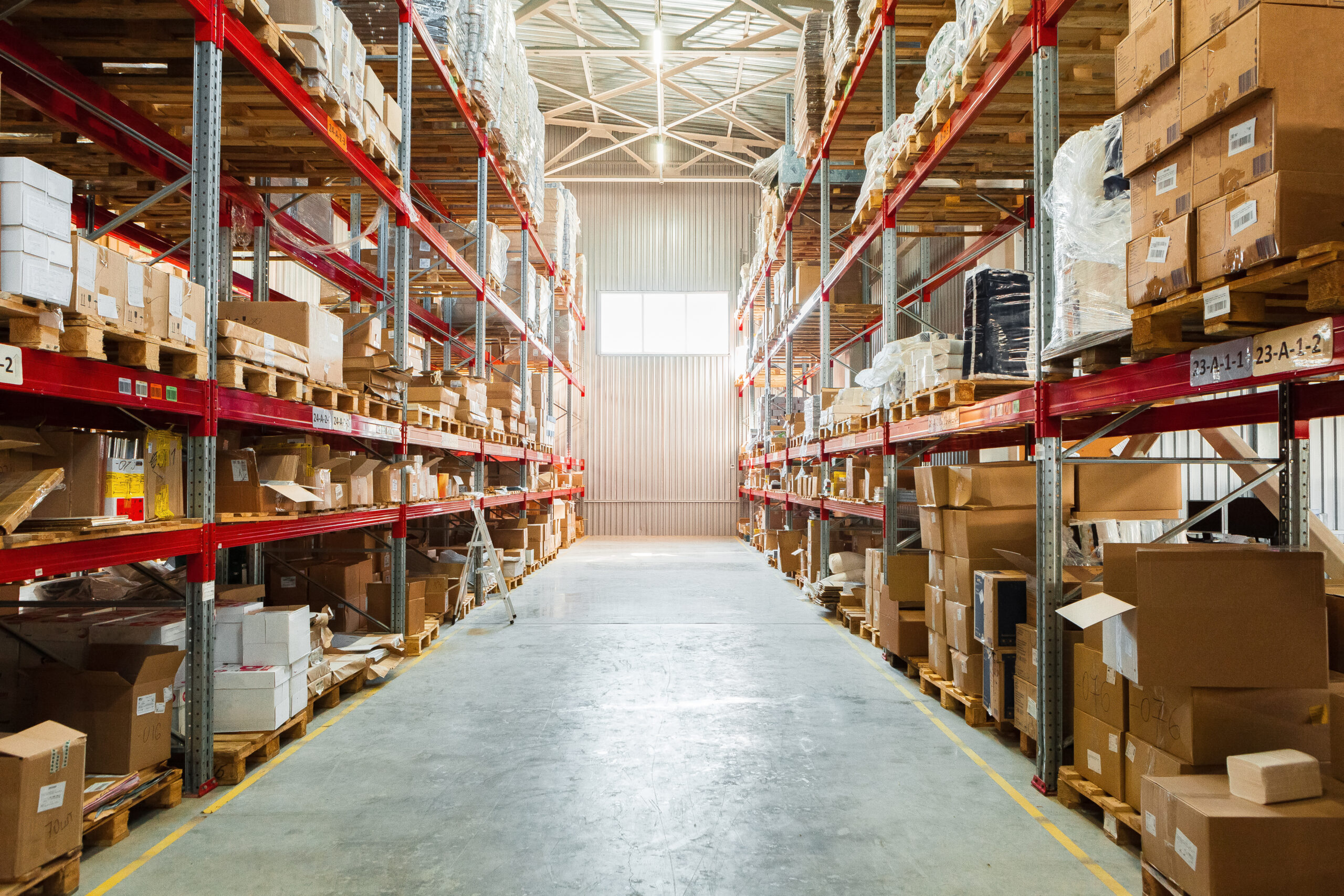 Commercial Pest Control Services: warehouse shelving stacked with cardboard boxes