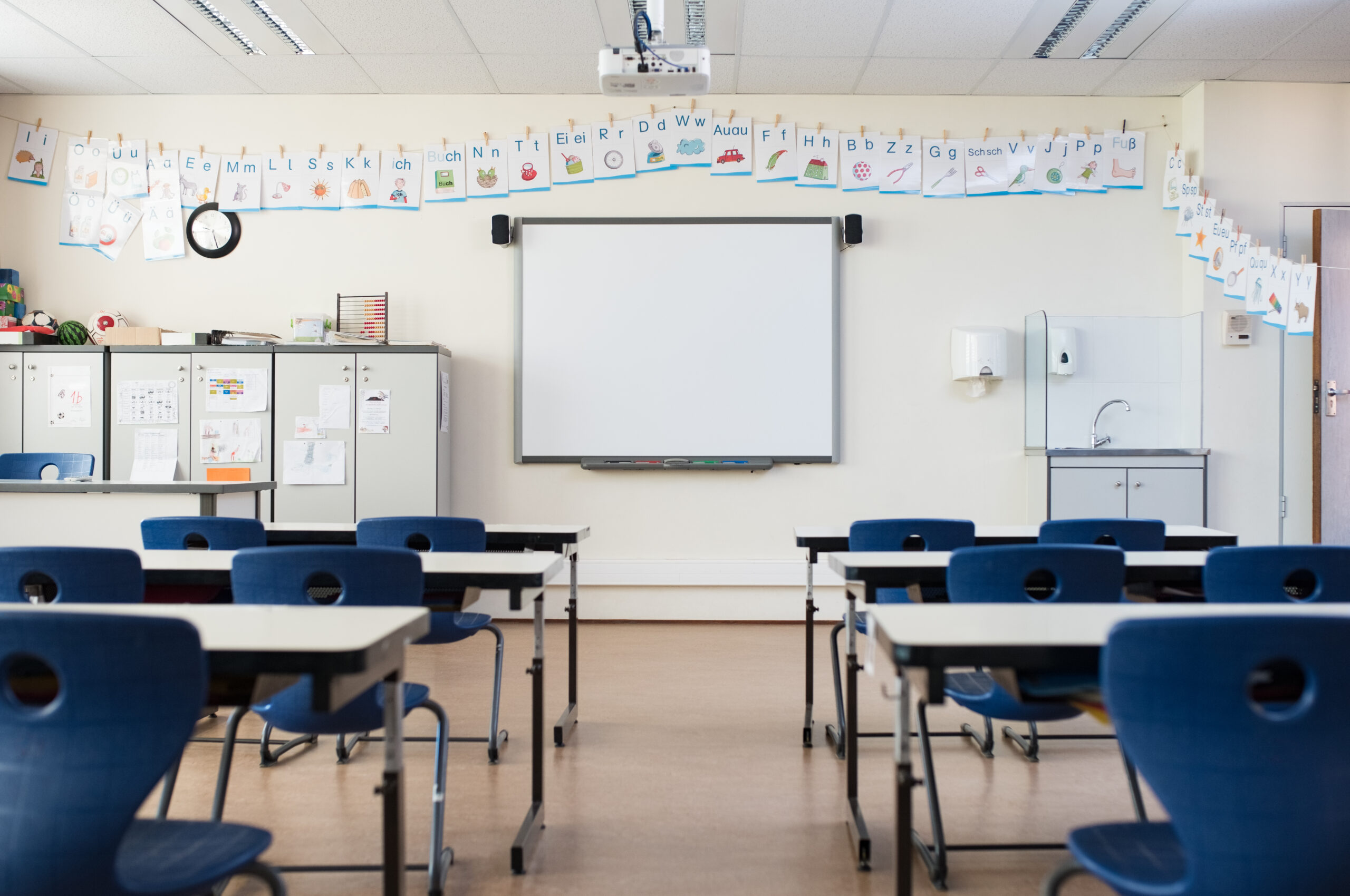 Schools & Education Pest Control: classroom with desks and a whiteboard